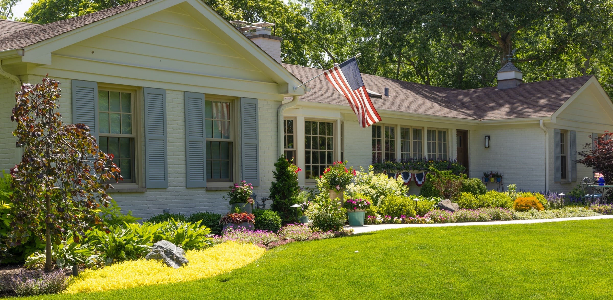 A meticulously planted North Shore estate garden in full summer bloom